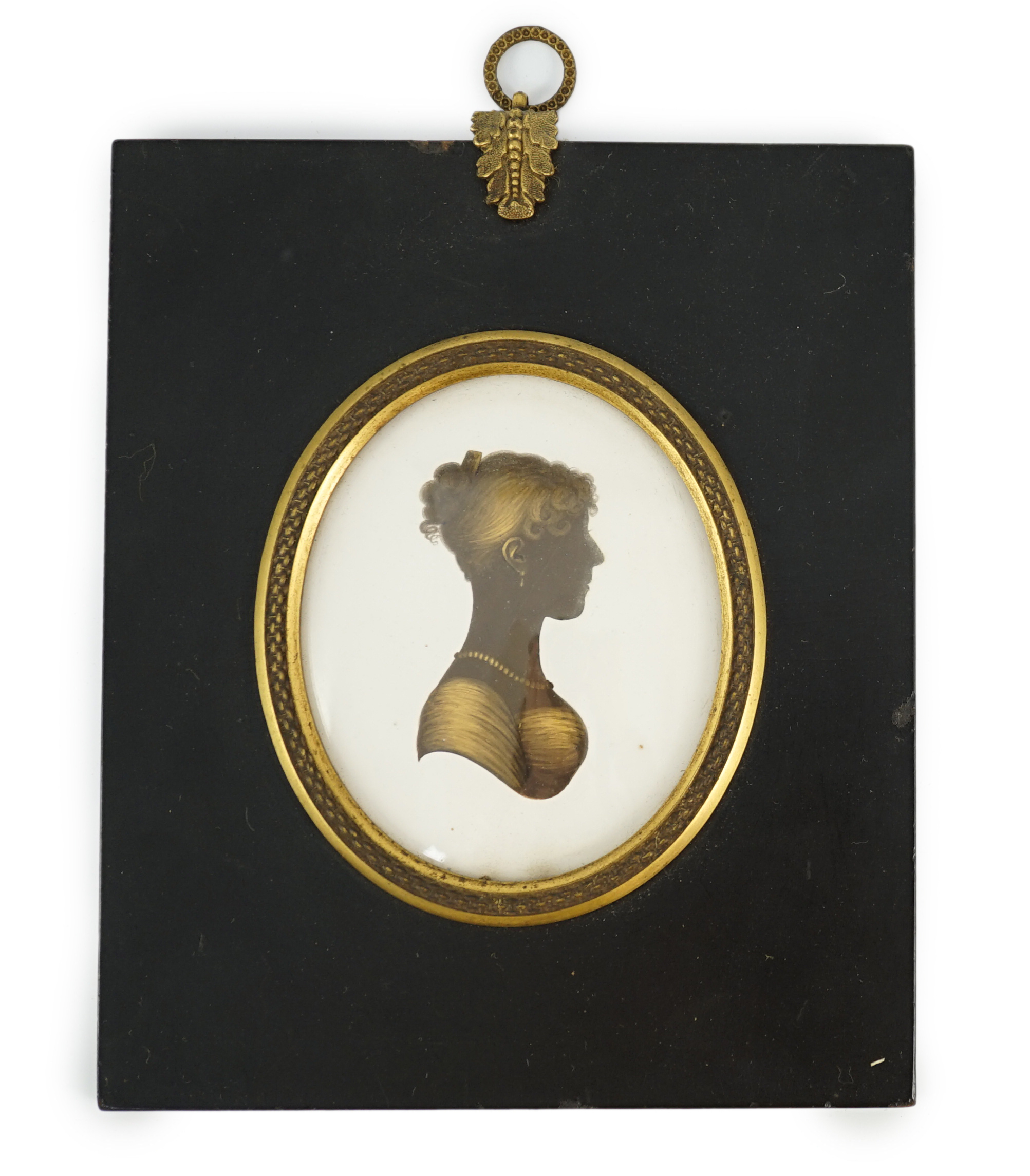 John Miers (1756-1821), Silhouette of a young lady, painted and bronzed plaster, 8 x 6.8cm.
